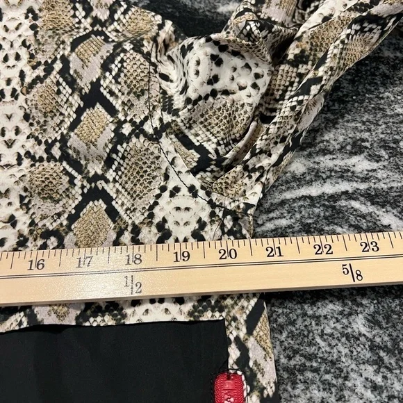 ALALA snakeskin anorak with red accents